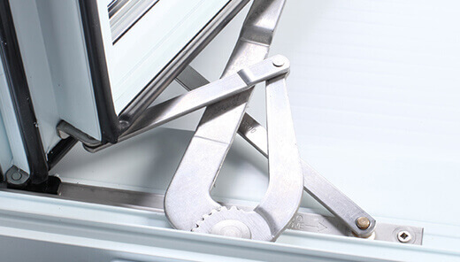 View of the mechanism at the bottom of a window for an example of durable stainless steel hardware for your awning windows