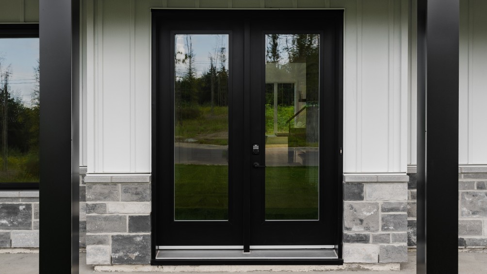 Porte‑jardin en acier avec verre clair