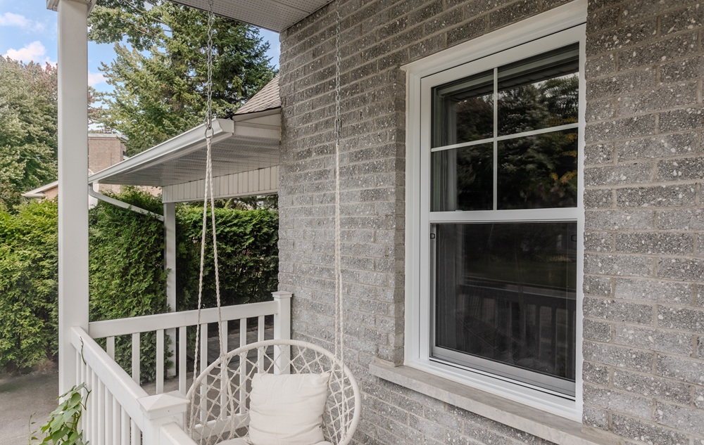 White hung window with integrated grilles